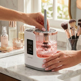 Electric makeup brush cleaner in use on vanity