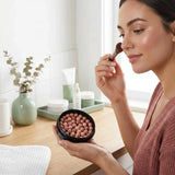 Cream Blush Roller applied to cheek