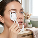 Electric Heated Eyelash Curler in use