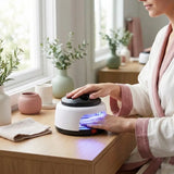 Woman using UV nail dryer