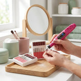 Woman using electric nail drill