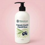 A 1 litre bottle of NatureLuxe Organic Castile Liquid Soap with a black pump dispenser, set against a soft pink background.